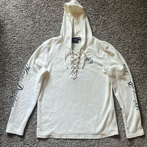 Women’s Harley Davidson Size XL Cream Long Sleeve with metal detailing on it.